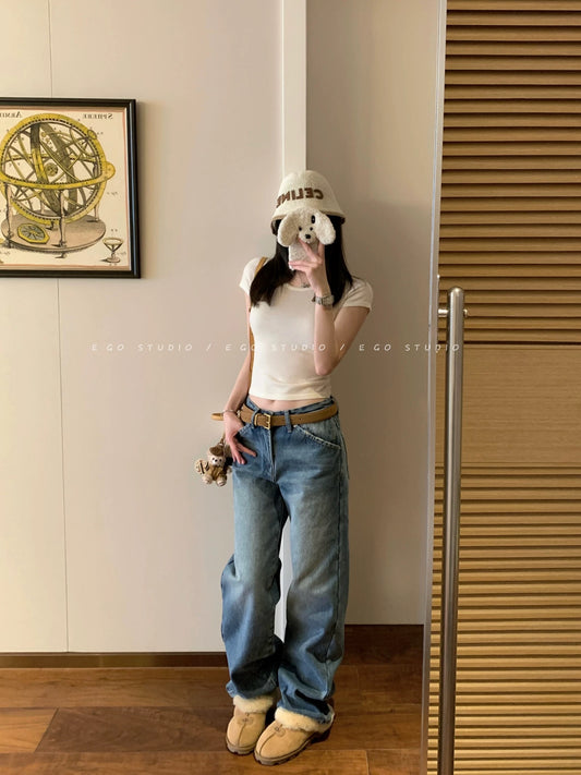 e go studio washed denim jeans in a light blue wash, flattering, versatile, and casual wide-leg trousers.