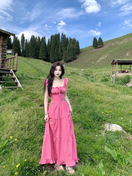 Dopamine wear small flying sleeve dress female summer 2025 new runaway princess seaside vacation backless long dress