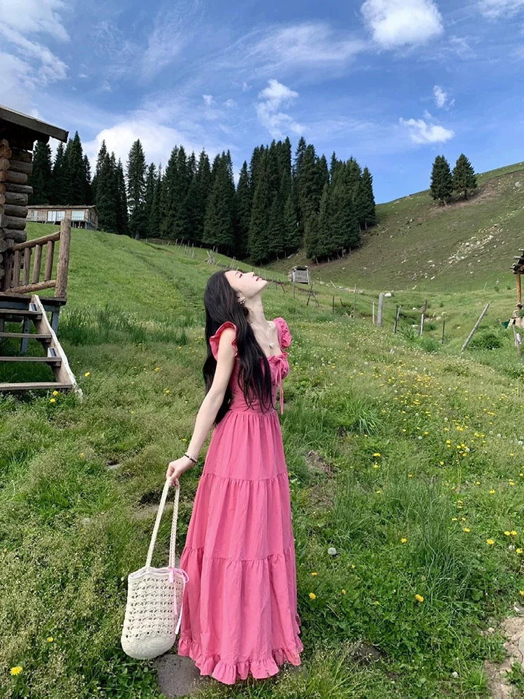 Dopamine wear small flying sleeve dress female summer 2025 new runaway princess seaside vacation backless long dress