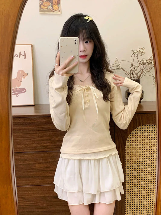 Cream Universe Bow fake two-piece apricot bottoming long-sleeved T-shirt women's sweet and gentle knitted top new style