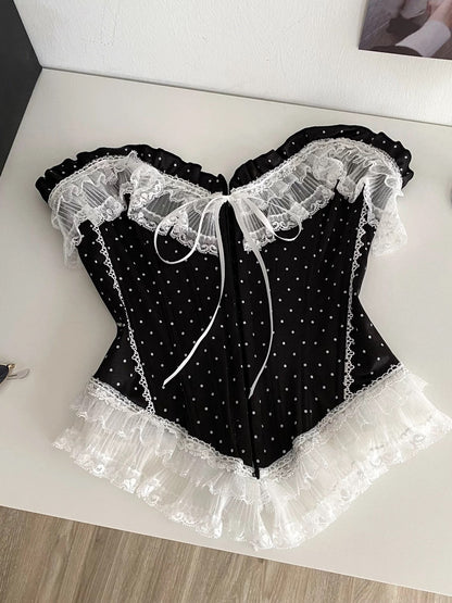 French-style court-inspired top for women, featuring lace trim, sleeveless strapless design, and a fitted boning polka dot pattern.