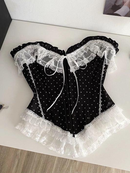 French-style court-inspired top for women, featuring lace trim, sleeveless strapless design, and a fitted boning polka dot pattern.