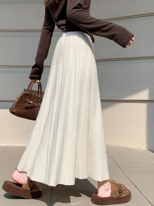 Gentle and soft knitted midi skirt for women, autumn and winter, ribbed pleated skirt, long and elegant high-waisted A-line skirt.