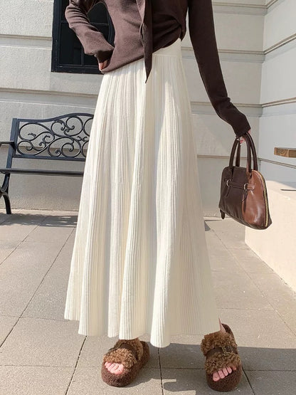 Gentle and soft knitted midi skirt for women, autumn and winter, ribbed pleated skirt, long and elegant high-waisted A-line skirt.