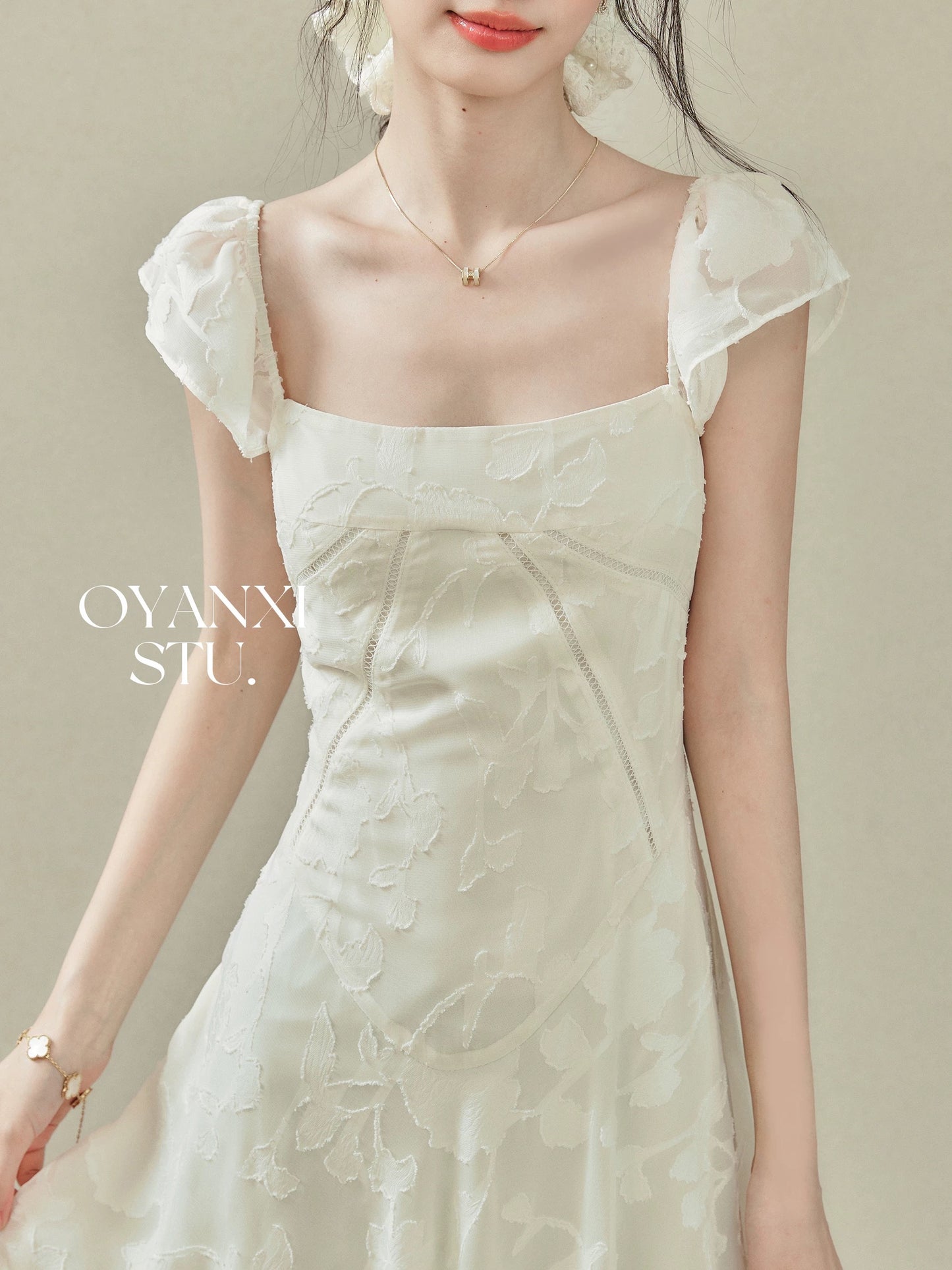 Ouyang Xi's "Glass Feathers" 2025 Summer New Arrival: A square-neck, fitted dress with flutter sleeves for women.