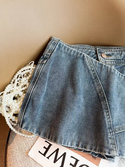 Korean style blue low-waisted denim shorts skirt, women's 2026 summer new style, button design, A-line slimming skirt.