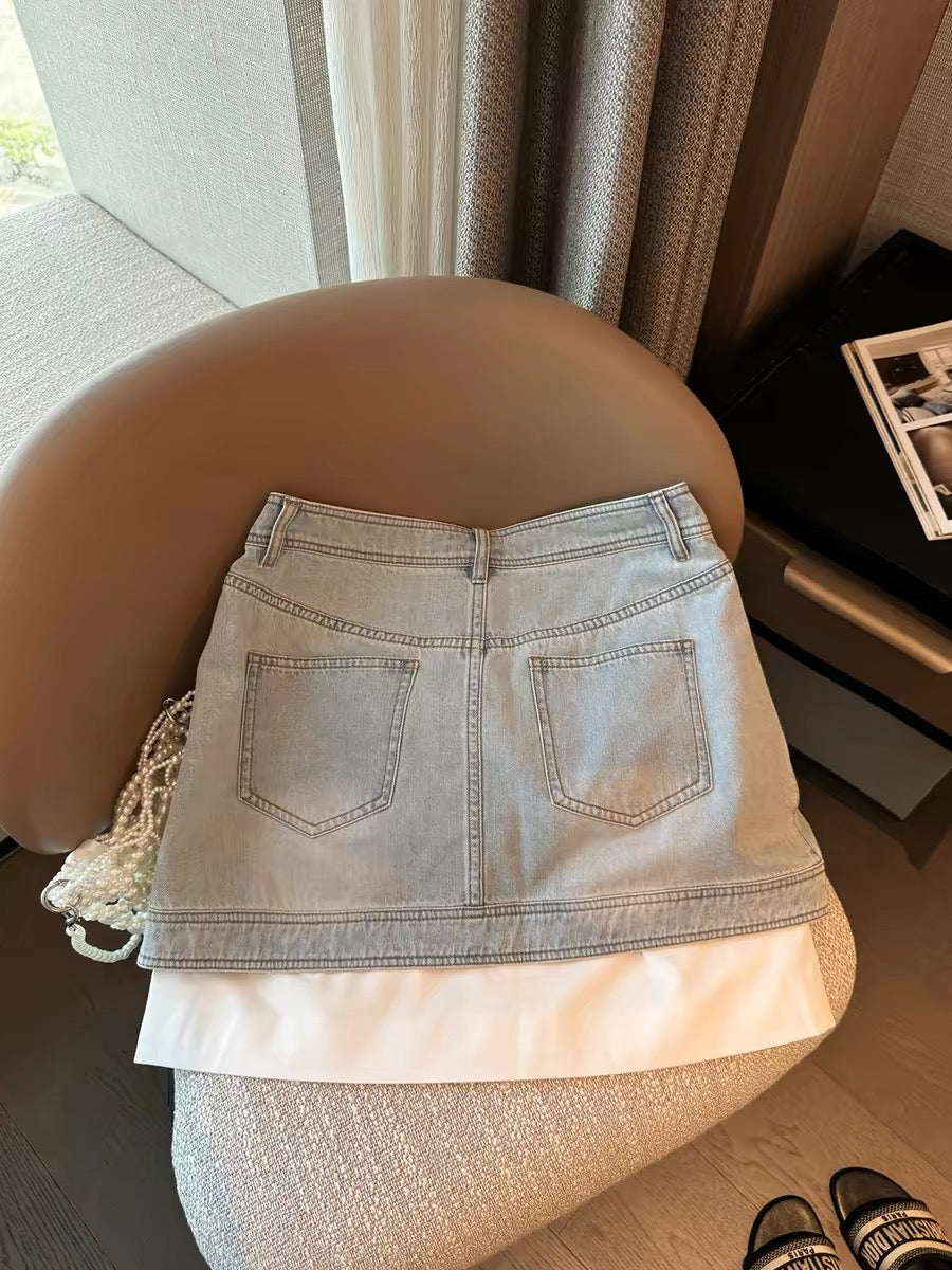 Women's A-line denim midi skirt with a two-piece design, a new summer 2026 style. A popular trend this year.