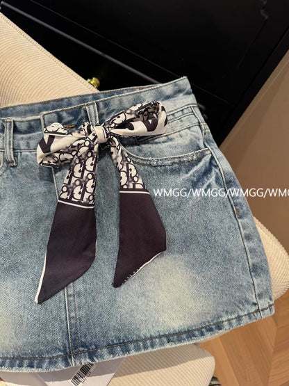 Blue denim mini skirt with bow design, new summer 2026 style, high-waisted, sexy, anti-exposure A-line skirt.