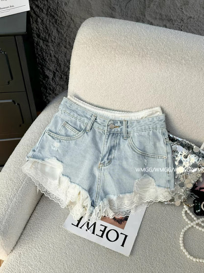 Light blue denim shorts for women, super trendy in 2026, featuring ripped details, patchwork lace trim, and sexy hot pants.