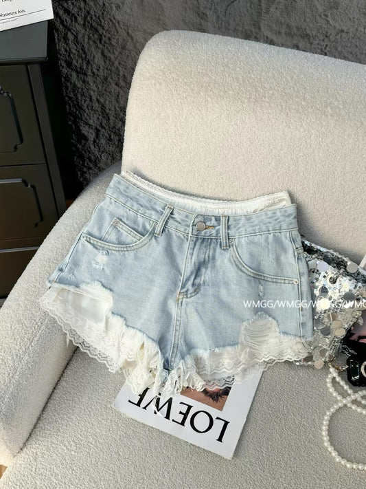 Light blue denim shorts for women, super trendy in 2026, featuring ripped details, patchwork lace trim, and sexy hot pants.