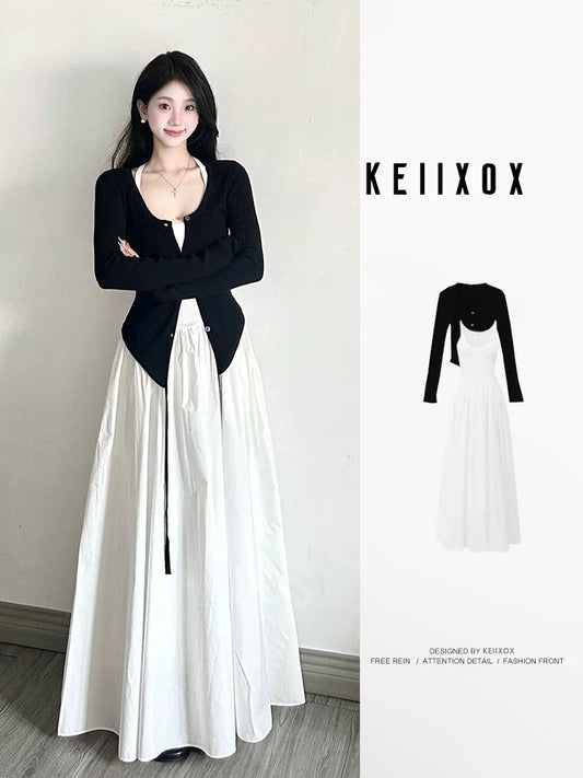 Early autumn wear a complete set of high-end black cardigan with temperament white dress salty mature two-piece suit