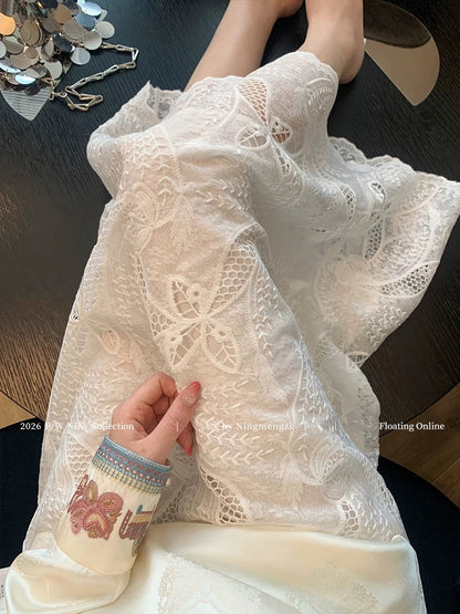 French-style white openwork lace embroidered midi skirt for women, new spring 2026, high-end, versatile, and youthful A-line skirt.