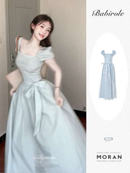 French-style fresh blue short-sleeved square neck dress, perfect for summer, with a beautiful bow, slimming waist, and elegant long dress.