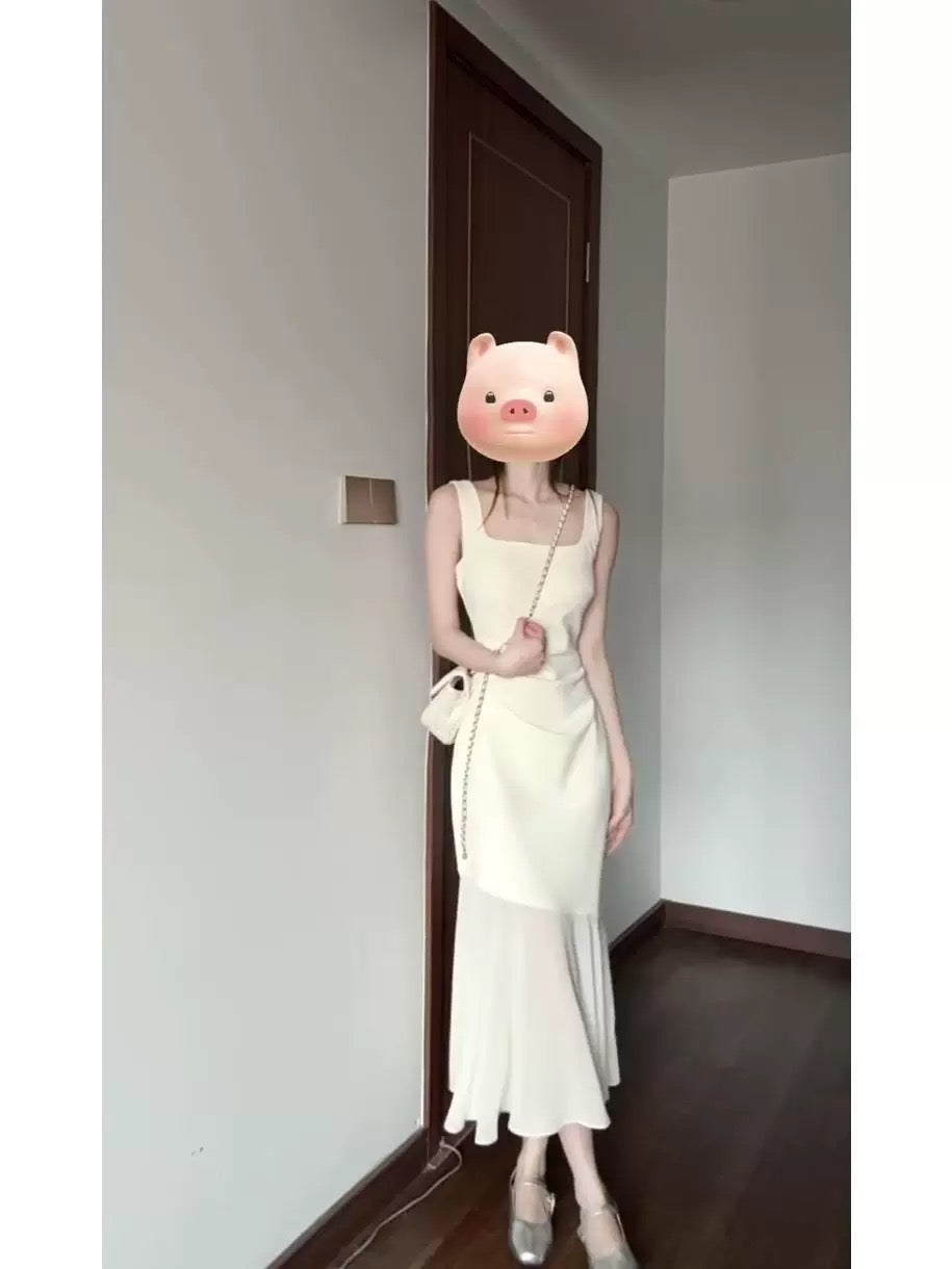 French-style sleeveless white halter dress for women, 2025 new summer seaside resort fishtail maxi dress, high-end feel.