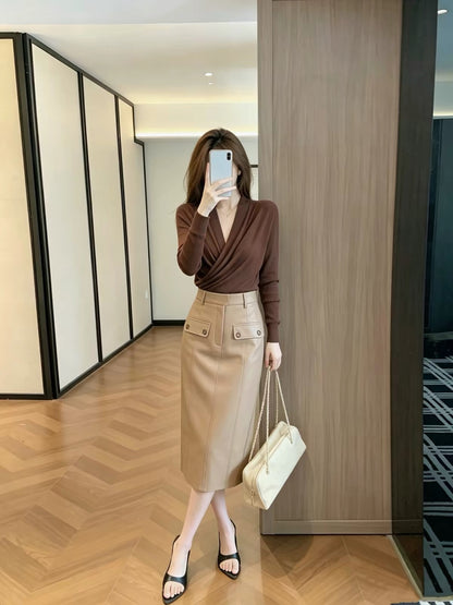 Leathercat Midi Skirt – A trendy, viral hit this year: a vintage-style, high-waisted, straight-cut midi skirt with utility-inspired details.