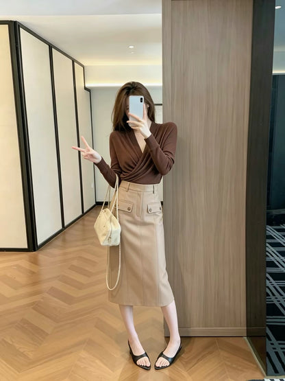 Leathercat Midi Skirt – A trendy, viral hit this year: a vintage-style, high-waisted, straight-cut midi skirt with utility-inspired details.