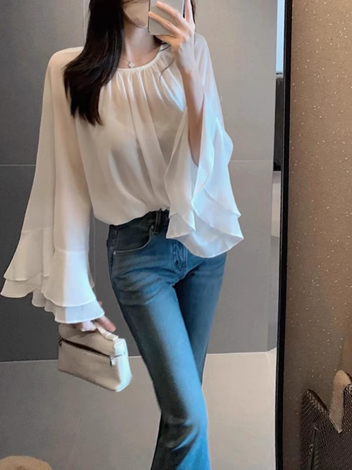 Stunning white women's chiffon blouse—a gorgeous, premium-feel, "quiet luxury" style piece from the Autumn 2026 collection, perfect for layering.