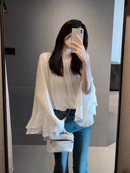 Stunning white women's chiffon blouse—a gorgeous, premium-feel, "quiet luxury" style piece from the Autumn 2026 collection, perfect for layering.
