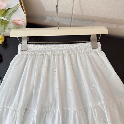 French-style openwork crochet embroidered white midi skirt for women, spring 2026, elastic waist, hip-covering A-line full skirt.