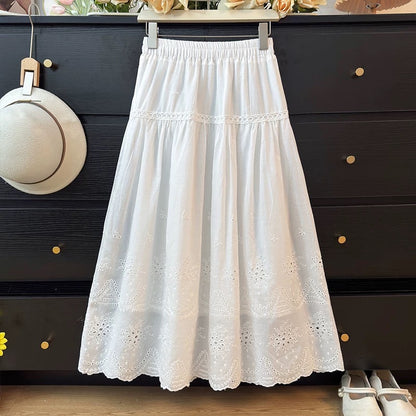 French-style delicate hollowed-out crochet embroidered midi skirt for women, spring 2026, high-waisted A-line pleated flared skirt.