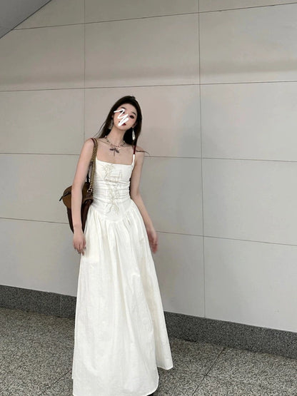 French suspender dress for women, summer waist slimming, over-the-knee long skirt, niche design, floral A-line skirt, trendy