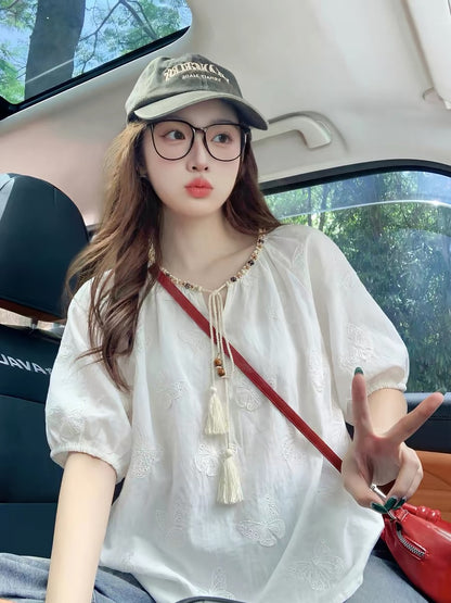 White, short-sleeved, embroidered, puff-sleeve blouse for women, summer 2026 new style, niche, high-end feel.