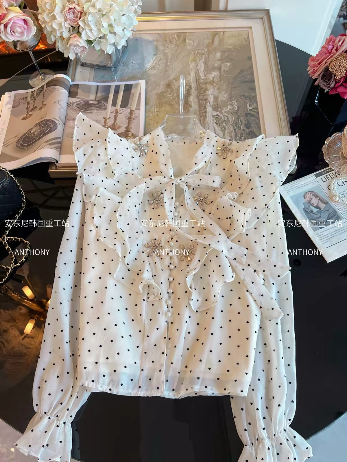 Women's French-style long-sleeve blouse for Autumn 2026—featuring a unique, chic design with polka dots, rhinestone accents, and ruffled details.