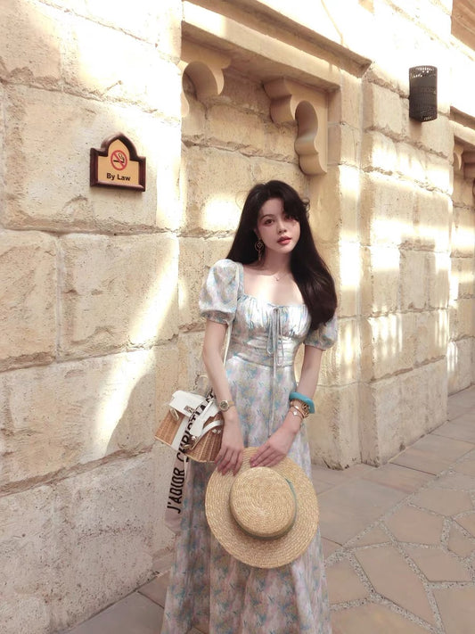 Eees' signature linen and Tencel French-style square neckline dress, perfect for a relaxing afternoon.