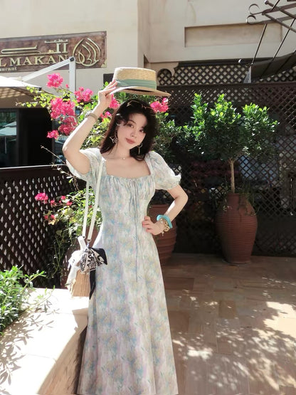 Eees' signature linen and Tencel French-style square neckline dress, perfect for a relaxing afternoon.