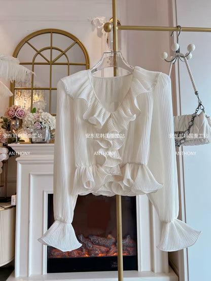 Women's Autumn 2026 French-style cropped chiffon blouse featuring a V-neck, ruffled details, textured pleats, flared sleeves, and a fitted waist.