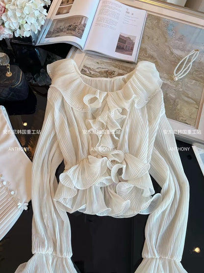 Women's Autumn 2026 French-style cropped chiffon blouse featuring a V-neck, ruffled details, textured pleats, flared sleeves, and a fitted waist.