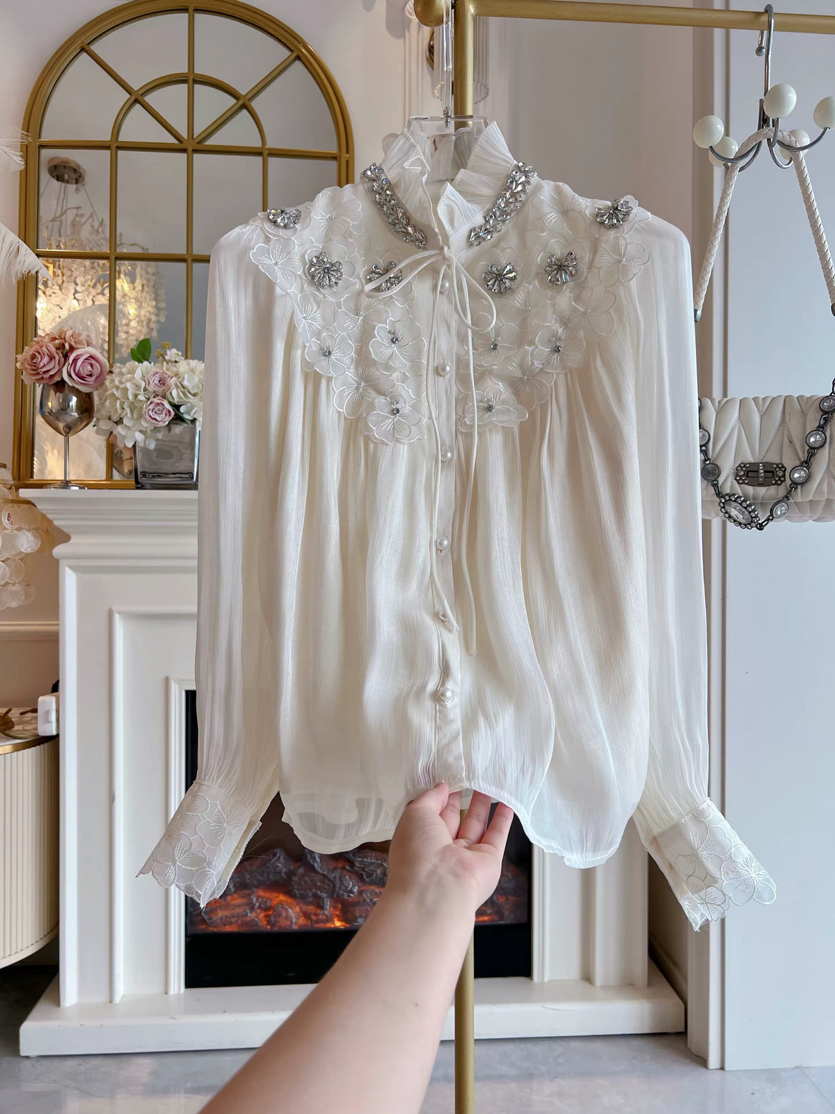 Trendy Korean-style loose-fit chiffon blouse featuring intricate rhinestone embellishments, 3D petal details, a single-breasted front, and long sleeves.