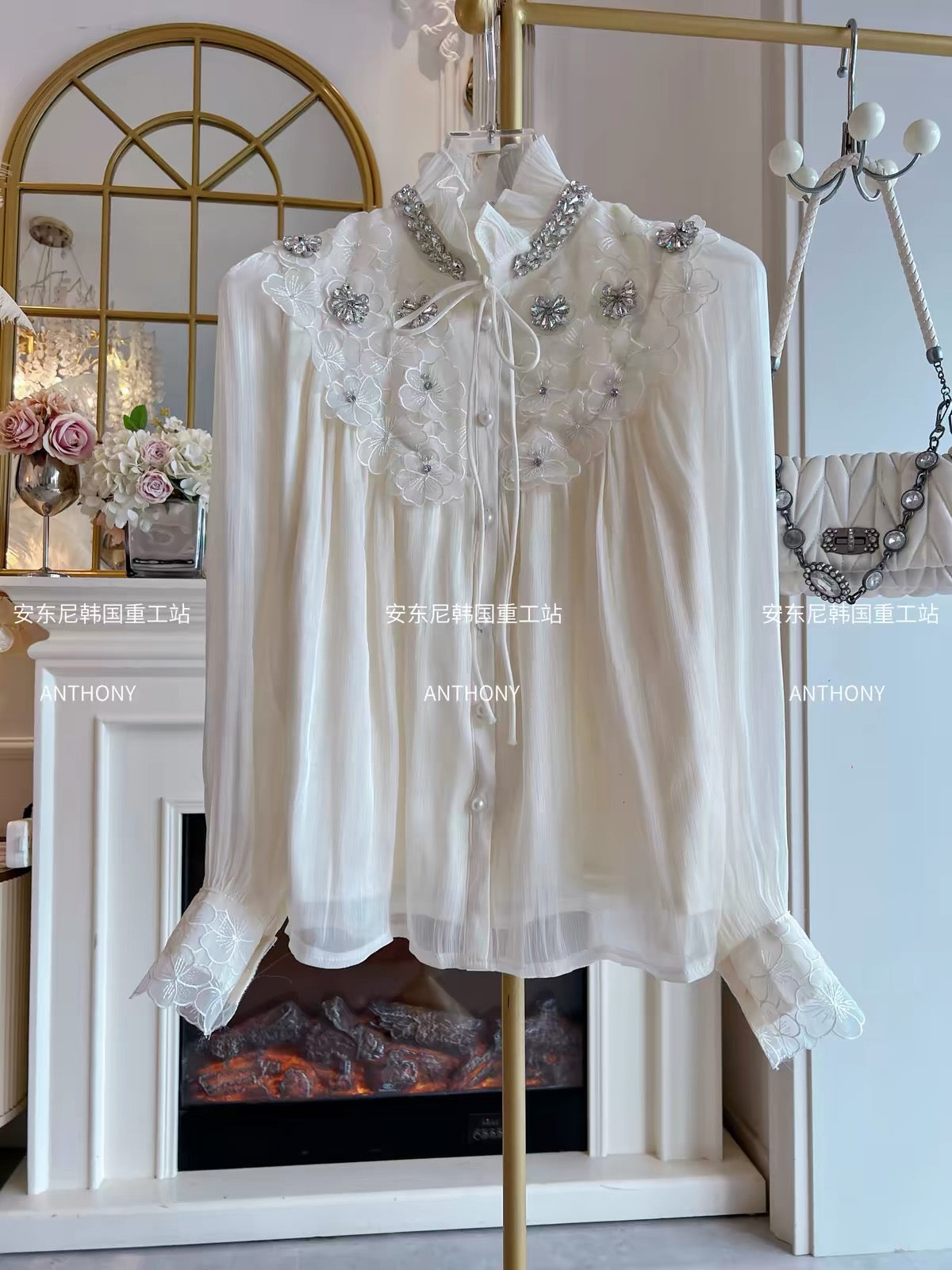 Trendy Korean-style loose-fit chiffon blouse featuring intricate rhinestone embellishments, 3D petal details, a single-breasted front, and long sleeves.