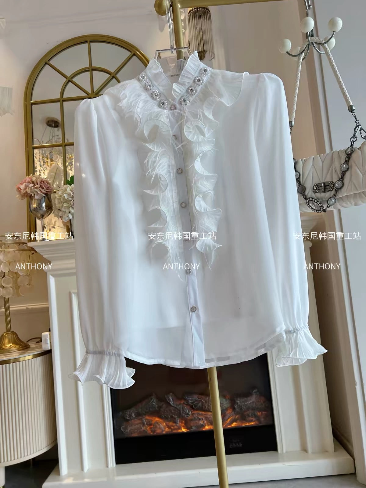Women's two-piece set featuring a loose-fitting, long-sleeved chiffon blouse adorned with feathers, ruffles, and intricate rhinestone embellishments, plus a matching top.