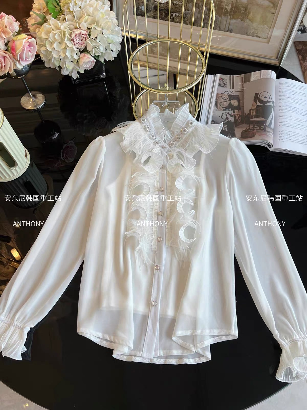 Women's two-piece set featuring a loose-fitting, long-sleeved chiffon blouse adorned with feathers, ruffles, and intricate rhinestone embellishments, plus a matching top.