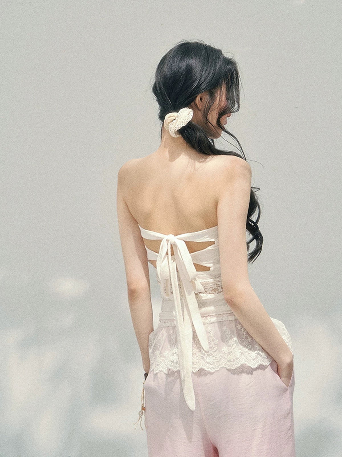 AOMALM's "Dazed Muse" sheer lace cutout thin strapless T-shirt for women, perfect for early spring and a sexy look.
