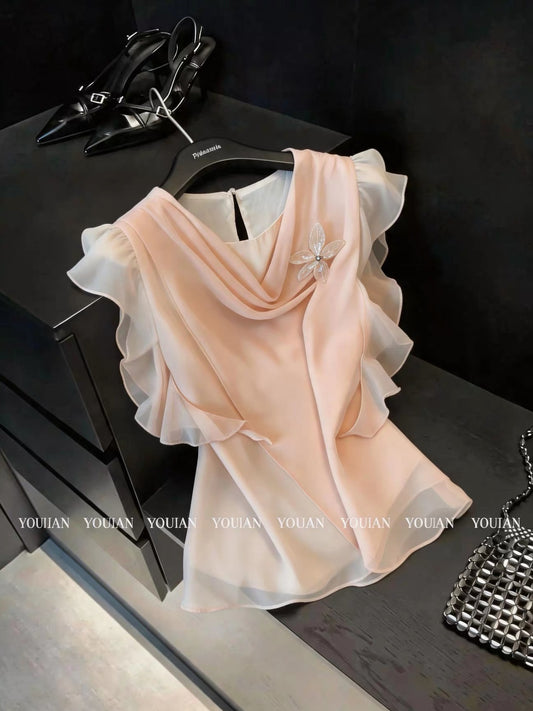 French chic and sophisticated design: a chiffon blouse with a flowing neckline, three-dimensional floral ruffles, and short sleeves.