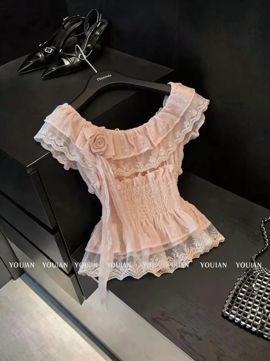 French-style chic, pretty off-the-shoulder short-sleeved blouse with ruffles and three-dimensional flowers; sophisticated, unique, and ethereal.