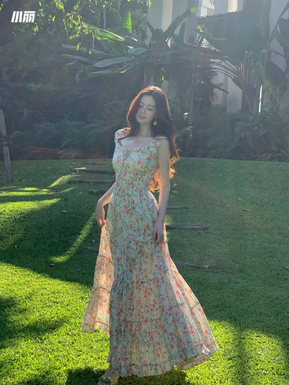 Xiao Li "Chasing the Wind in the Wilds" — Red floral-print maxi camisole dress featuring a paneled, tiered, voluminous A-line skirt.