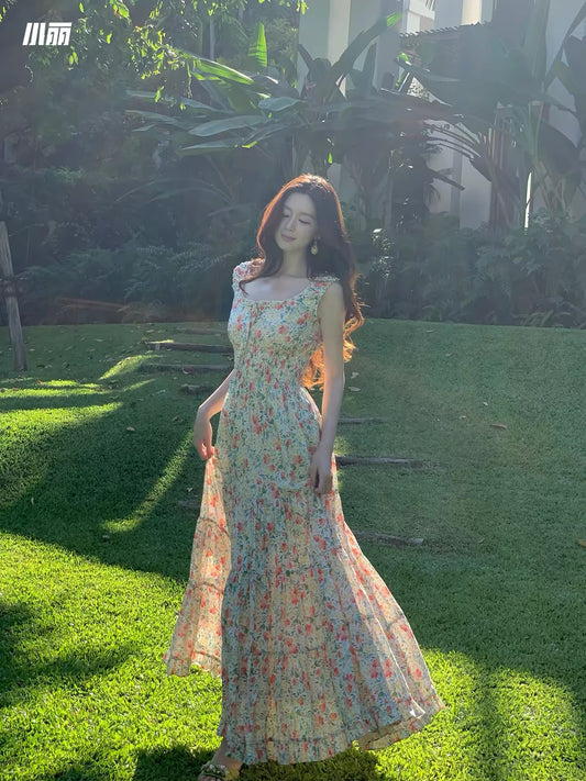 Xiao Li "Chasing the Wind in the Wilds" — Red floral-print maxi camisole dress featuring a paneled, tiered, voluminous A-line skirt.