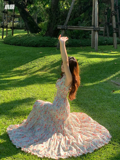 Xiao Li "Chasing the Wind in the Wilds" — Red floral-print maxi camisole dress featuring a paneled, tiered, voluminous A-line skirt.