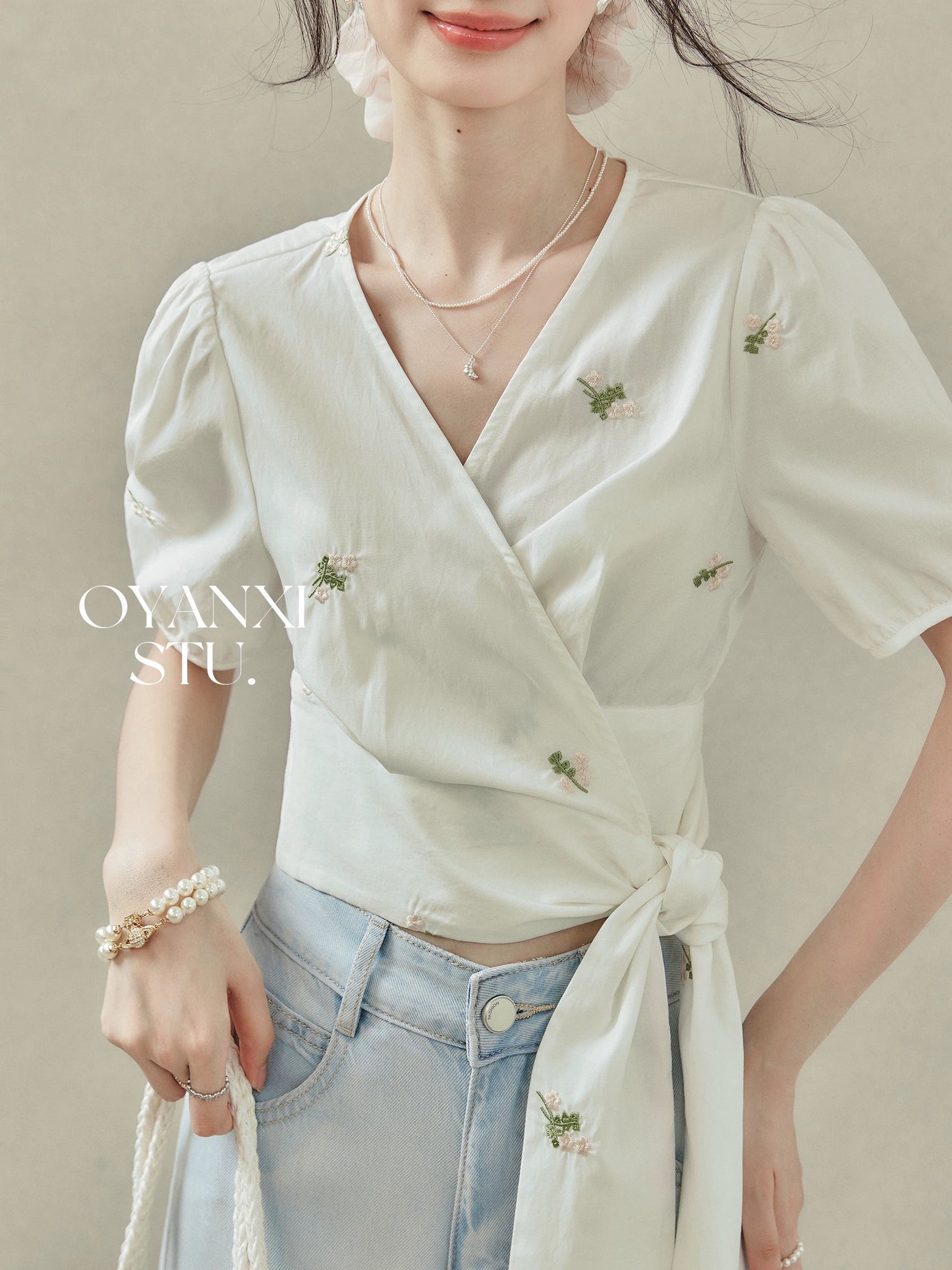 Ouyang Xi "Lily of the Valley Island" cross-strap waist shirt short-sleeved V-neck top summer short floral blouse