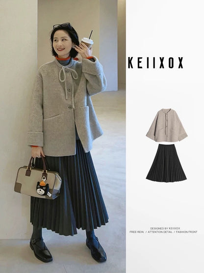 A sophisticated Korean-style winter outfit: a gray wool short coat and pleated skirt two-piece set.