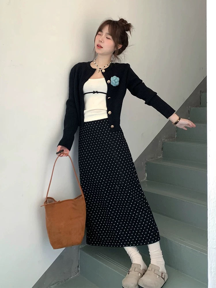 A complete Korean-style outfit for petite women, featuring a knitted cardigan and polka-dot skirt, perfect for early spring 2025.