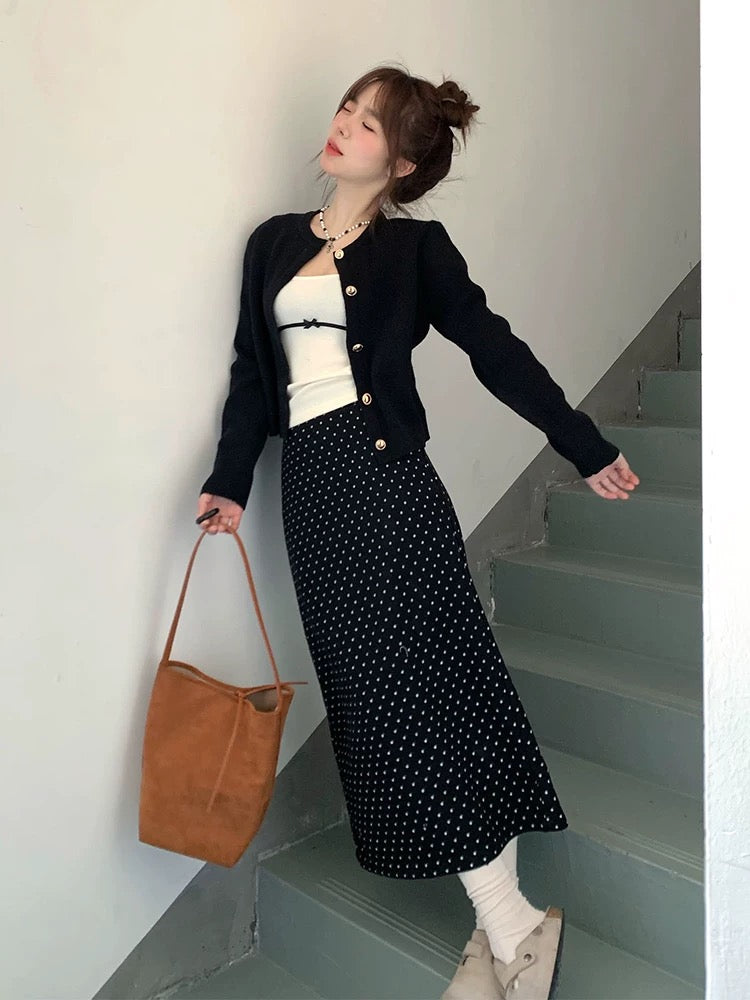 A complete Korean-style outfit for petite women, featuring a knitted cardigan and polka-dot skirt, perfect for early spring 2025.