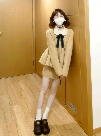 A sophisticated Korean-style Chanel-inspired two-piece winter outfit: a Peter Pan collar knit sweater and skirt set.