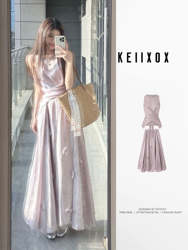 A stunning summer outfit: a complete French-style two-piece set featuring a fitted, sleeveless top and a purple midi skirt.