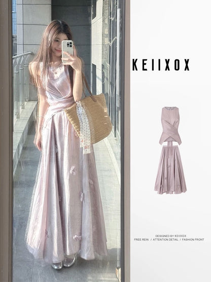A stunning summer outfit: a complete French-style two-piece set featuring a fitted, sleeveless top and a purple midi skirt.