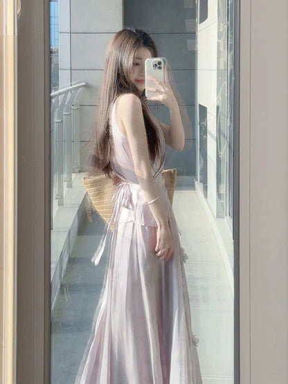 A stunning summer outfit: a complete French-style two-piece set featuring a fitted, sleeveless top and a purple midi skirt.