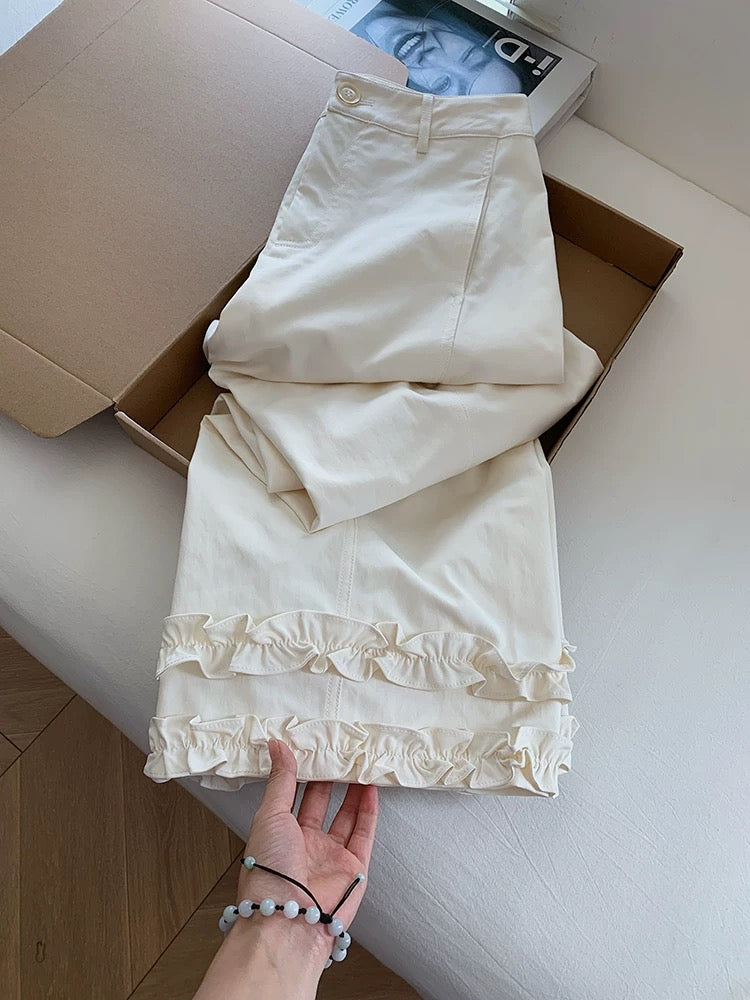 White high-waisted flared casual pants with ruffled hem, women's 2025 new style wide-leg pants with a flared design.